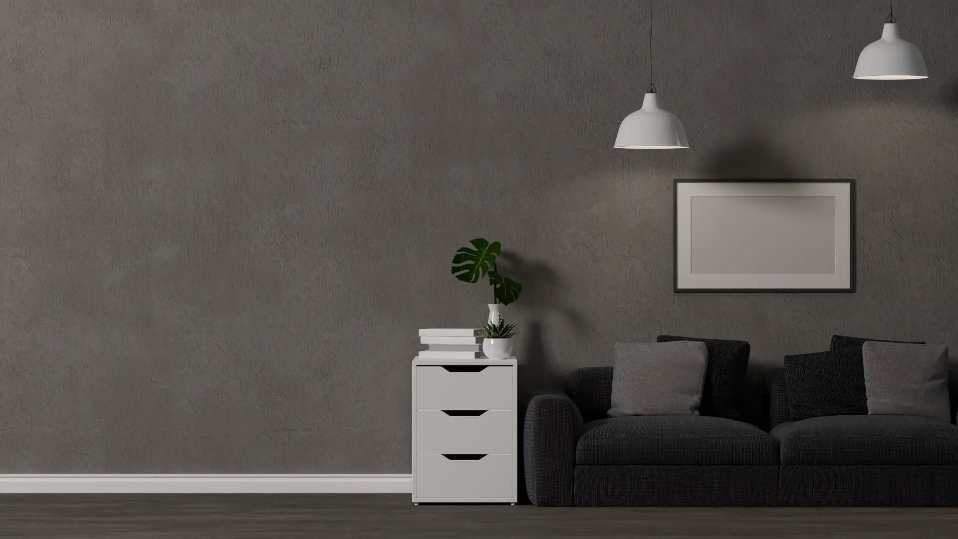 Moderne stue med grå væg, sort sofa og minimalistisk indretning.